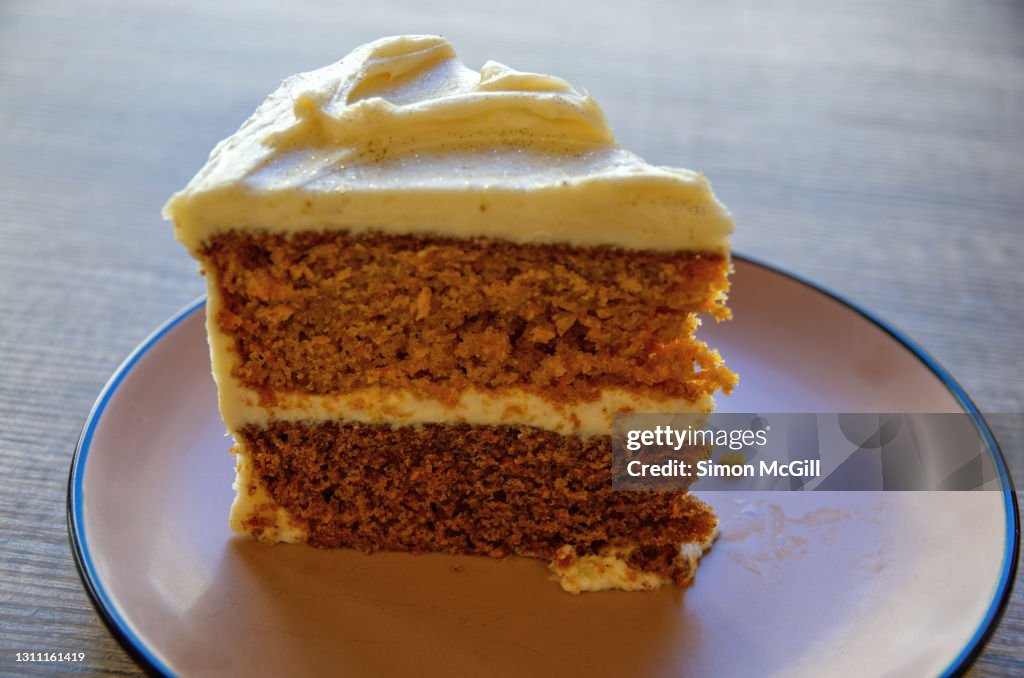 Slice of carrot cake with cream cheese frosting