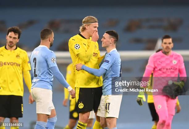 Phil Foden of Manchester City and Erling Haaland of Borussia Dortmund interact following the UEFA Champions League Quarter Final match between...