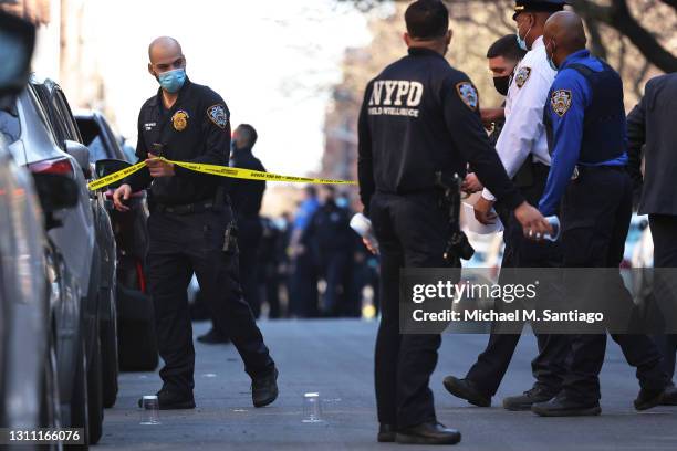 Officers respond to the scene of a shooting that left multiple people injured in the Flatbush neighborhood of the Brooklyn borough on April 06, 2021...