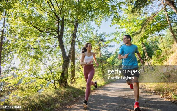 healthy lifestyle by two sportspersons. - spring norway stock pictures, royalty-free photos & images