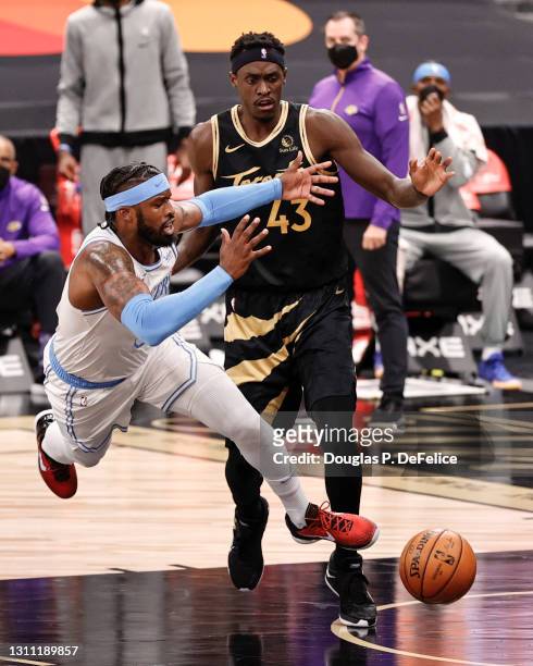 Wesley Matthews of the Los Angeles Lakers battles Pascal Siakam of the Toronto Raptors for the ball during the second quarter at Amalie Arena on...