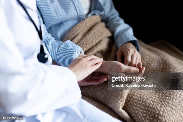 home nursing care, home medical care - japan aging population stock pictures, royalty-free photos & images