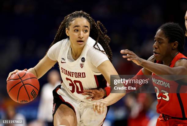 Haley Jones of the Stanford Cardinal heads for the net as Bendu Yeaney of the Arizona Wildcats defends during the National Championship game of the...