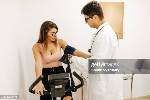 medical examination of pulse, blood pressure and stress test - stress test stock pictures, royalty-free photos & images