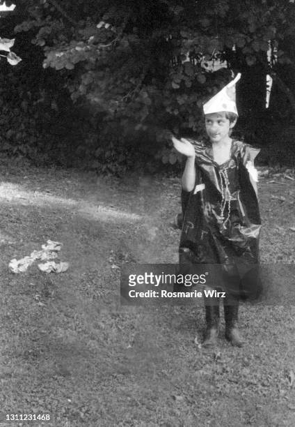 young boy dressed up acting as a clown in garden - ambivere stock pictures, royalty-free photos & images