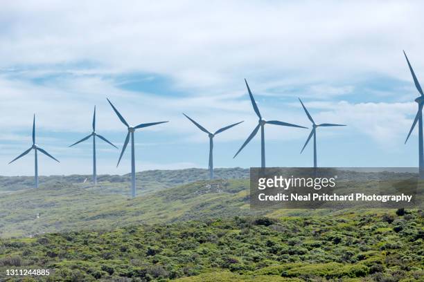 wind turbines along coastal strip - wind farm australia fotografías e imágenes de stock