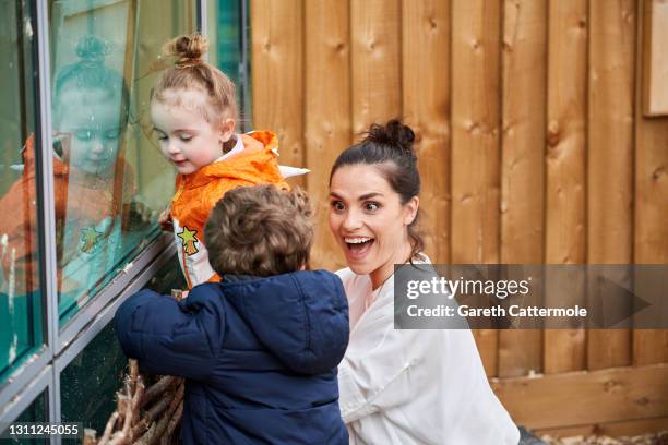 In this image released on the April 9th, Charlotte Riley, actress and co-founder of the Wonderworks plays with children at Warner Bros Studios on...