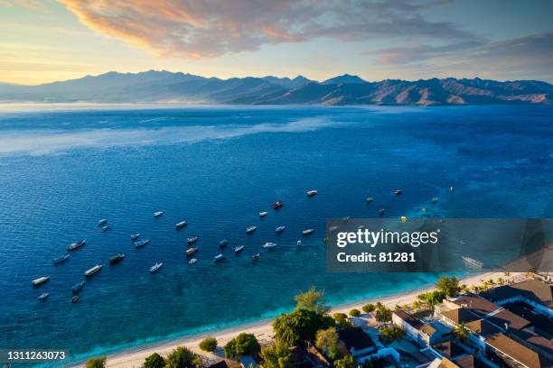 aerial view of gili trawangan beach and boats anchored in ocean, lombok, west nusa tenggara, indonesia - gili trawangan stock pictures, royalty-free photos & images