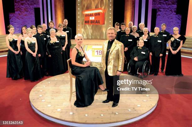 Deal or no Deal. Noel Edmonds posed with contestants March 28, 2009.