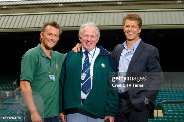 Broadcaster and retired professional tennis player Andrew Castle photographed with groundsmen Eddie Seaward and Neil Stubley at the All England Club...