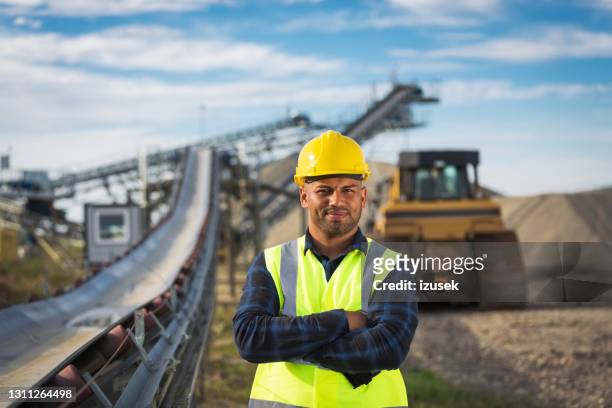 portrait of open-pit mine worker - mining natural resources stock pictures, royalty-free photos & images