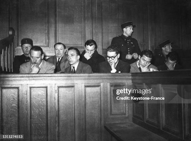 Maurice Sion, Joseph Joanovici, René Lefèvre, Gérard Hovine, Marcel Amauce, Henri Nicolas et Robert Godinger sur le banc des accusés lors du procès...