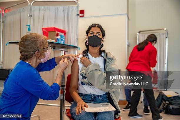 Senior student Srihita Mediboina receives the Moderna Covid-19 vaccine at Stony Brook University on April 6, 2021.