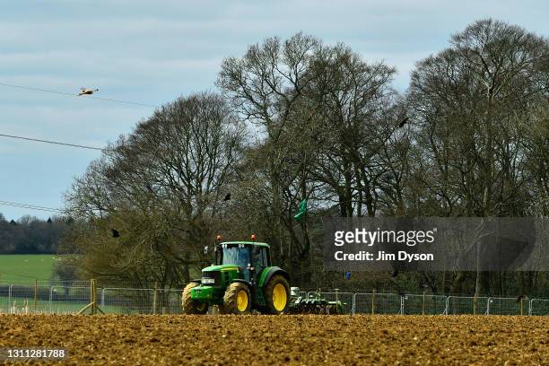 Red Kites follow a farmer as he ploughs his field in front of Jones Hill Wood, on April 07, 2021 in Great Missenden, England. After a prolonged legal...