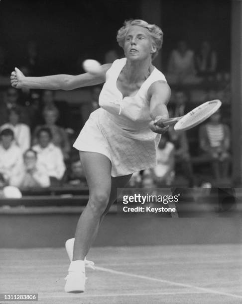 Ann Haydon-Jones of Great Britain reaches to make a forehand return shot to Nancy Richey of the United States during their singles match of the 38th...