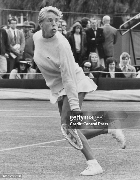 Ann Haydon-Jones of Great Britain watches her backhand return shot to Winnie Shaw during their Women's Singles Final match at the London Grass Court...