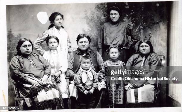 Postcard features a photograph of a group of unidentified women and children of the Osage Nation, Pawhuska, Oklahoma Territory, circa 1918