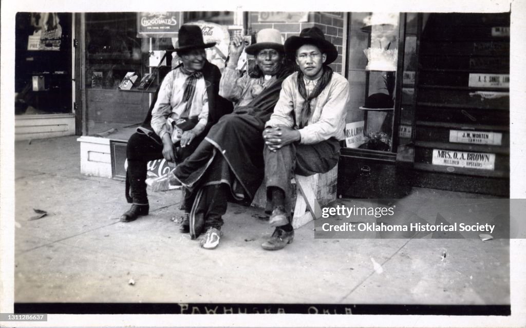 Portrait Of Three Osage Men Outside A Shop
