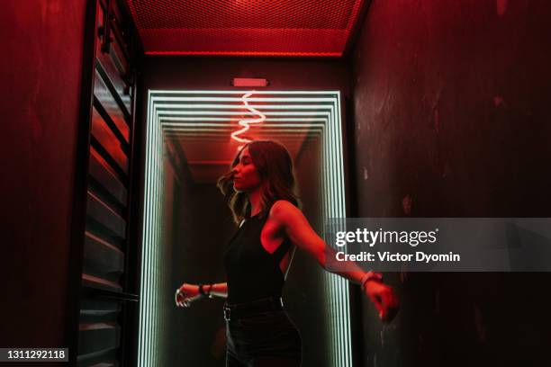 beautiful young brunette dances in the hall - night out stock pictures, royalty-free photos & images