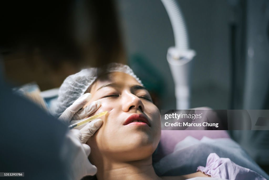 Asian Injection Mark Asian Chinese Female Customer Receiving Injection Treatment On Face At ...