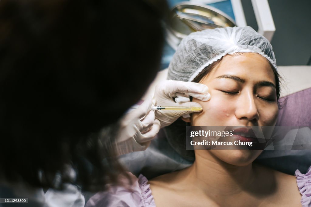 Asian Injection Mark Asian Chinese Female Customer Receiving Injection Treatment On Face At ...