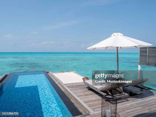 private overwater villa in the maldives - private beach stock pictures, royalty-free photos & images