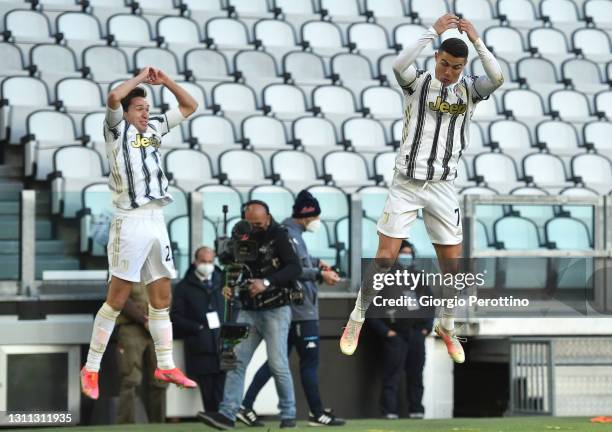 Cristiano Ronaldo of Juventus celebrates his 1-0 opening goal with his teammate Federico Chiesa during the Serie A match between Juventus and SSC...