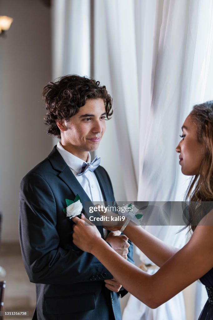 Teenage couple dressed for prom