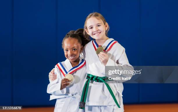 girls win taekwondo competition - martial arts kid stock pictures, royalty-free photos & images