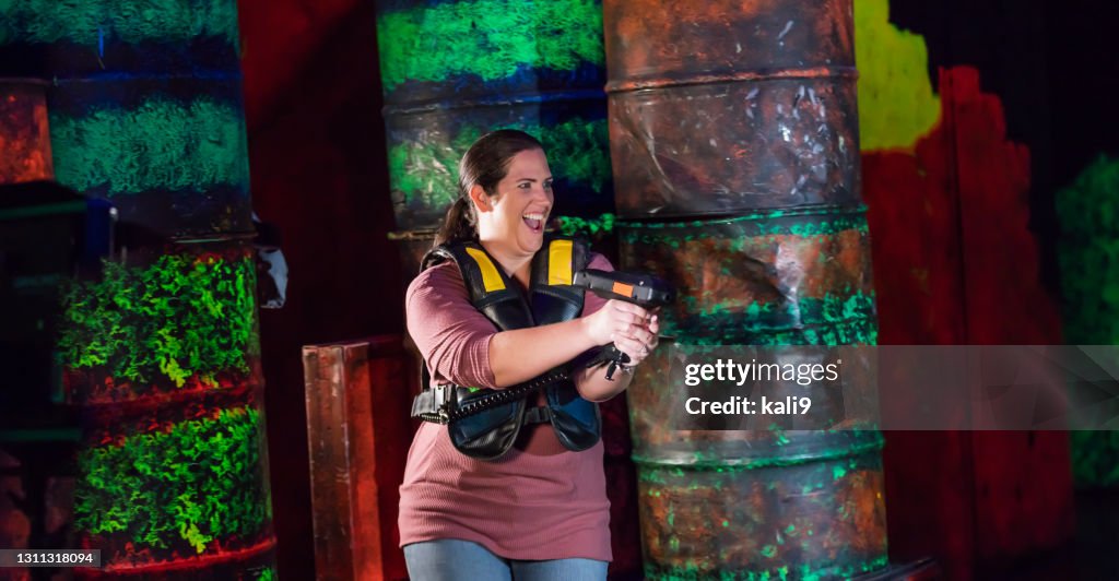 Woman playing laser tag