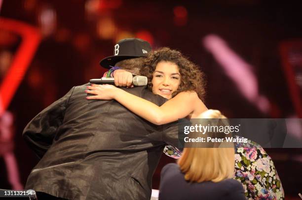 Monique Simon hugs her mentor Mirko Bogojevic during 'The X Factor Live' TV-Show on November 01, 2011 in Cologne, Germany.