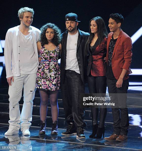 Artists Martin Madeja, Monique Simon, mentor Mirko Bogojevic, Raffaela Wais and Kassim Auale wait for the results of the televoting during 'The X...