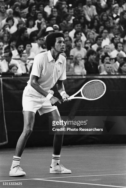 View of American tennis player Arthur Ashe on the court as he competes during the US Pro Championships, Brookline, Massachusetts, 1970s.