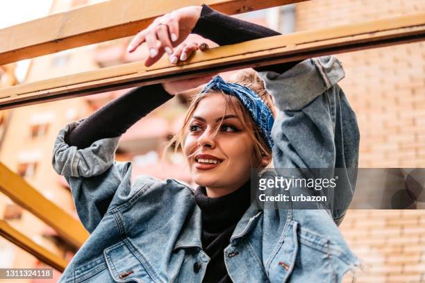 beautiful woman with headscarf - jean jacket stock pictures, royalty-free photos & images