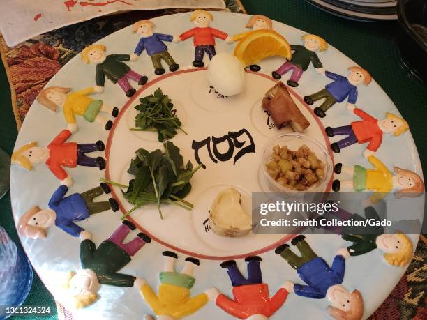 Close-up shot of a Passover Seder plate with a hard-boiled egg, nuts and herbs in Lafayette, California, March 28, 2021.