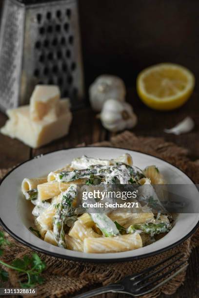 asparagus pasta on a rustic background - macaroni salad stock pictures, royalty-free photos & images