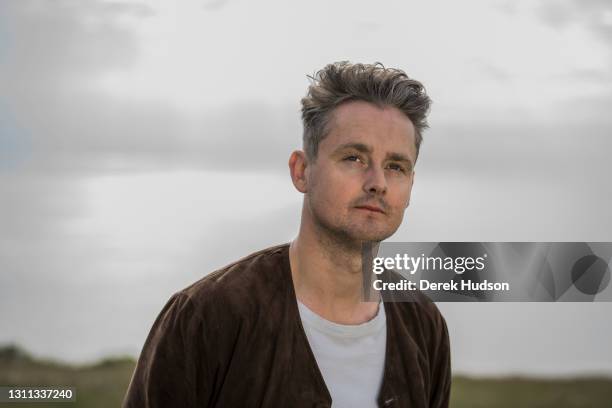 English pop singer and musician Tom Chaplin pictured during a photo session on a deserted road at Birling Gap, near Eastbourne, to promote his solo...