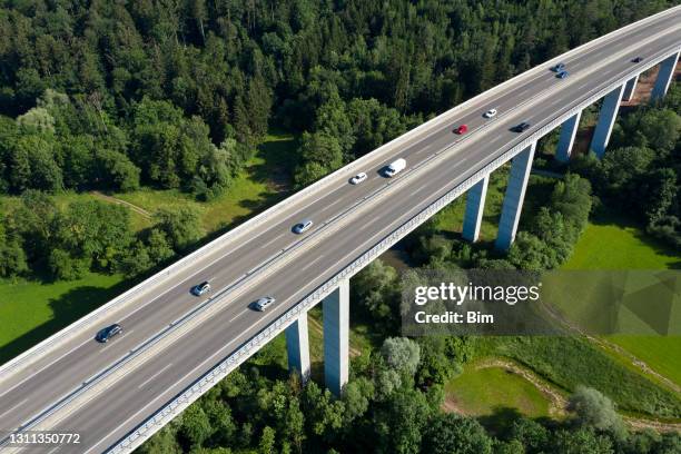 highway bridge with car traffic, aerial view - green bridge over trees stock pictures, royalty-free photos & images