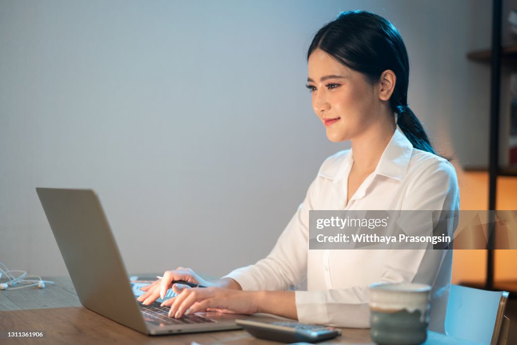 Teen girl doing homework on her laptop