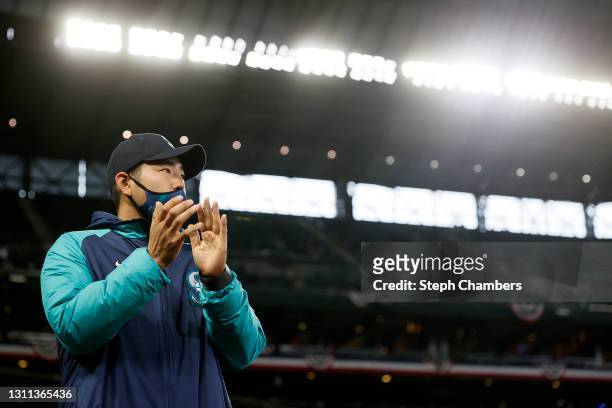 Yusei Kikuchi of the Seattle Mariners claps for his teammates before the game against the Chicago White Sox at T-Mobile Park on April 07, 2021 in...