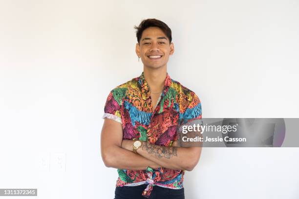 portrait of young man against a white wall - pacific islander stock pictures, royalty-free photos & images