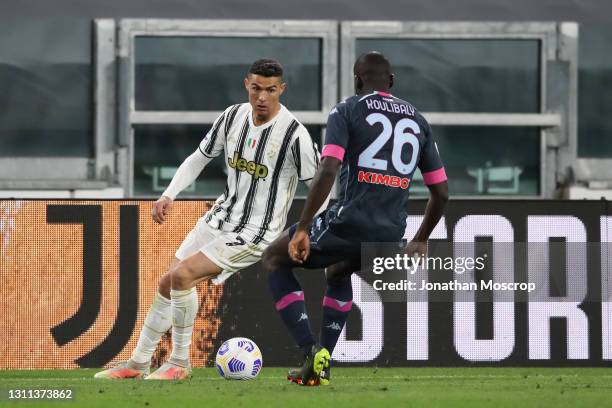 Cristiano Ronaldo of Juventus is confronted by Kalidou Koulibaly of SSC Napoli during the Serie A match between Juventus and Napoli at Allianz...