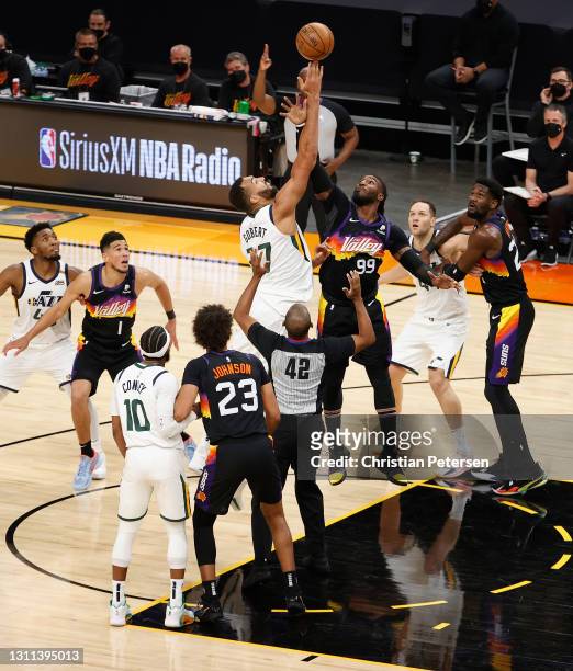Jae Crowder of the Phoenix Suns and Rudy Gobert of the Utah Jazz go up for a jump ball during the second half of the NBA game at Phoenix Suns Arena...