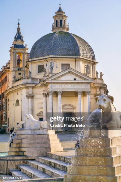the beautiful church of santa maria dei miracoli in piazza del popolo in the historic and baroque heart of rome - piazza del popolo rome stock pictures, royalty-free photos & images