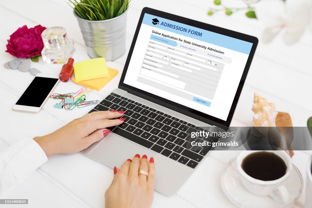 Submitting File From Computer Person Submitting Admission Form On Laptop Computer High-Res Stock ...