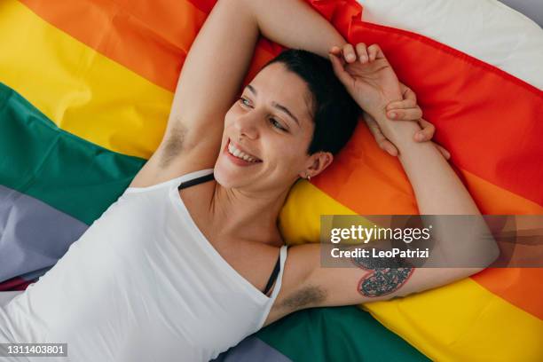 young woman relaxing on the bed - hairy women imagens e fotografias de stock