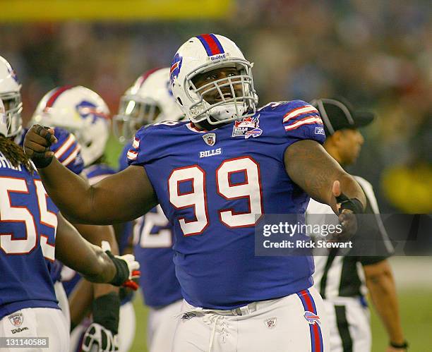 Marcell Dareus of the Buffalo Bills reacts after blocking a field goal attempt by the Washington Redskins at Rogers Centre on October 30, 2011 in...