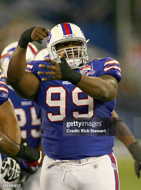 Marcell Dareus of the Buffalo Bills reacts after blocking a field goal attempt by the Washington Redskins at Rogers Centre on October 30, 2011 in...