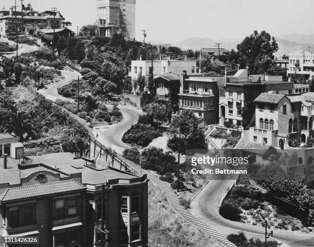Properties along Lombard Street, labelled 'the crookedest street in the world', a steep, one-block section with eight hairpin bends, running east to...
