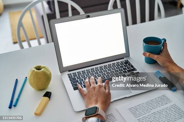 hands of unrecognizable woman using laptop with blank screen. - apple laptop stock pictures, royalty-free photos & images